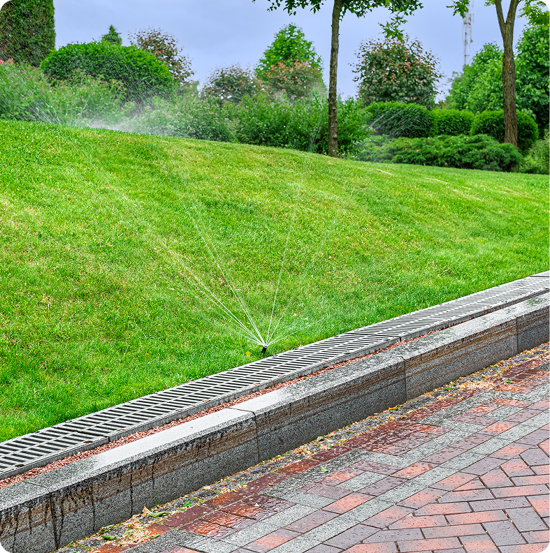 Park sprinkler system on grass